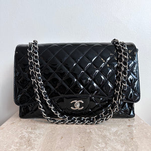 Pre-Owned CHANEL™ Black Patent Maxi Single Flap Bag
