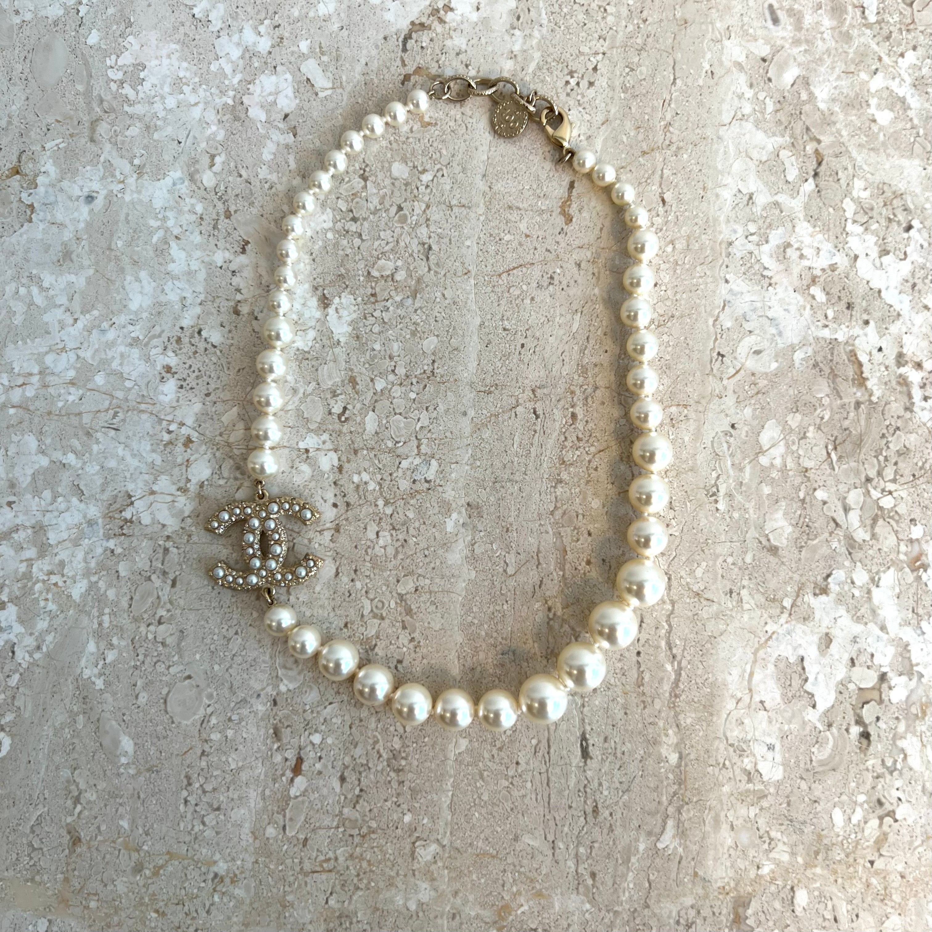 CHANEL Necklace choker of fancy pearls Signed on plat  Drouotcom