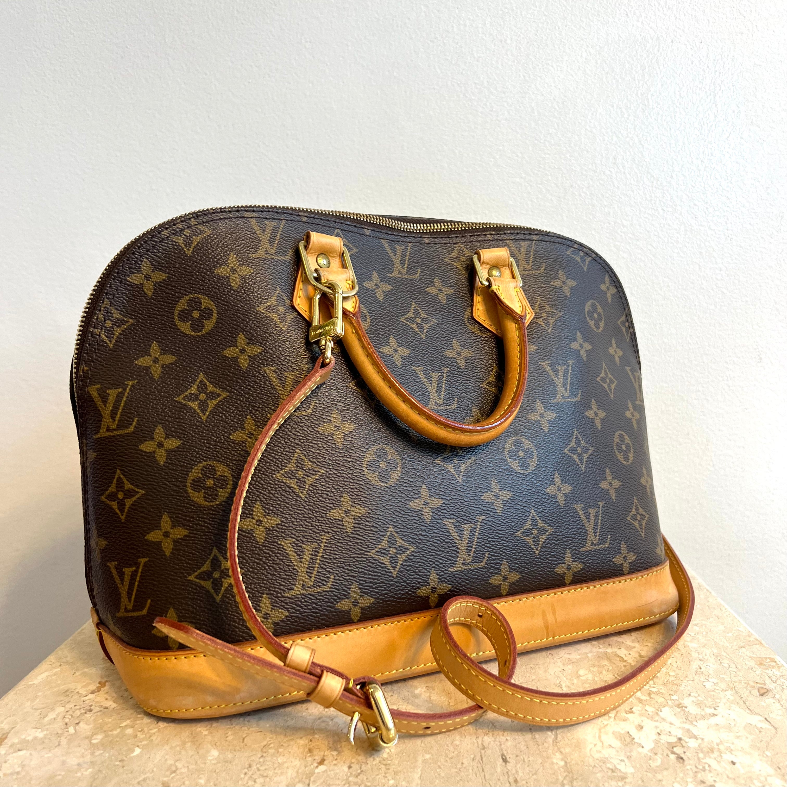 Pre-Owned Louis Vuitton Alma PM Monogram Satchel 